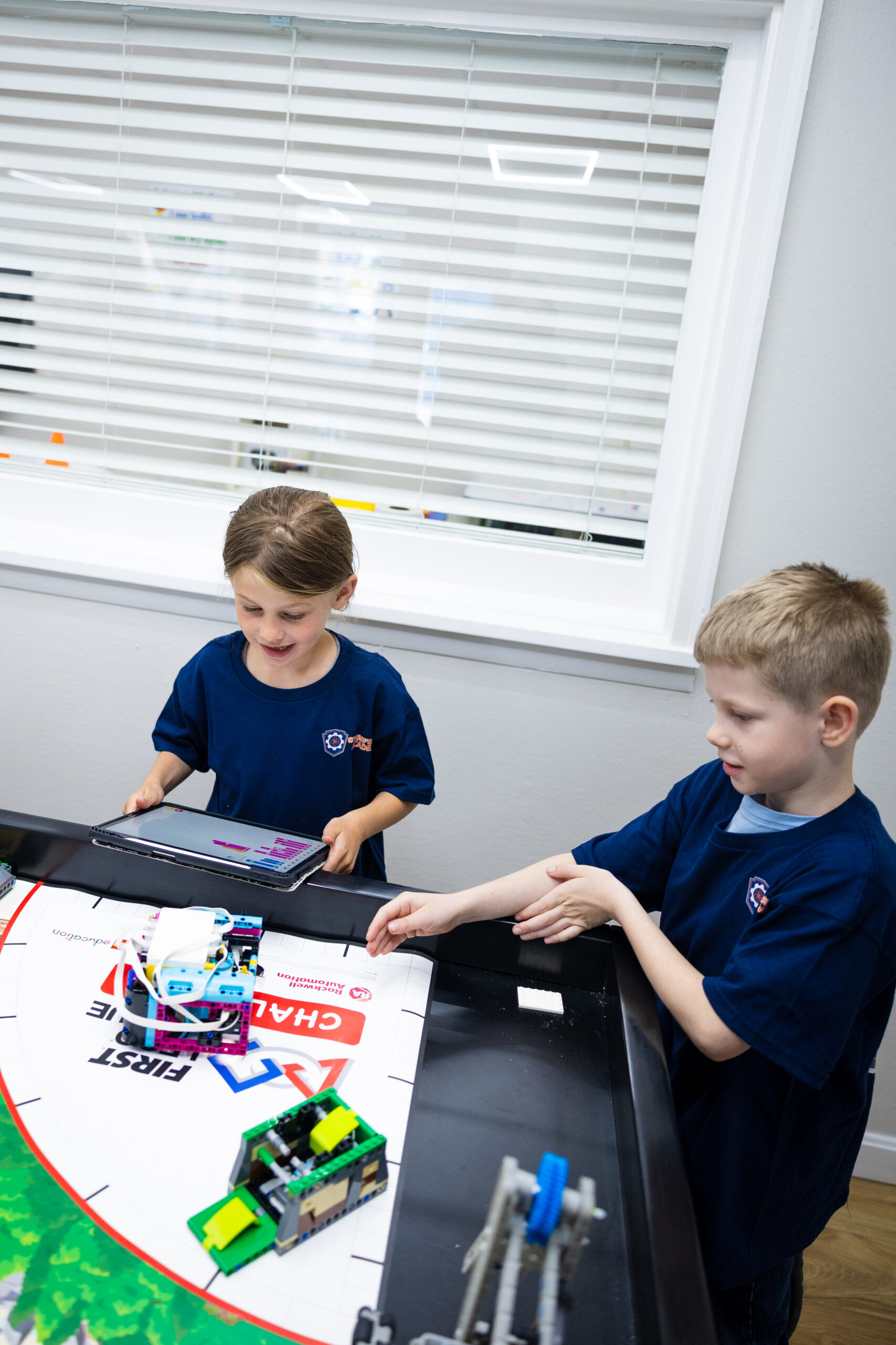 Young child engaged in hands-on STEM building activity