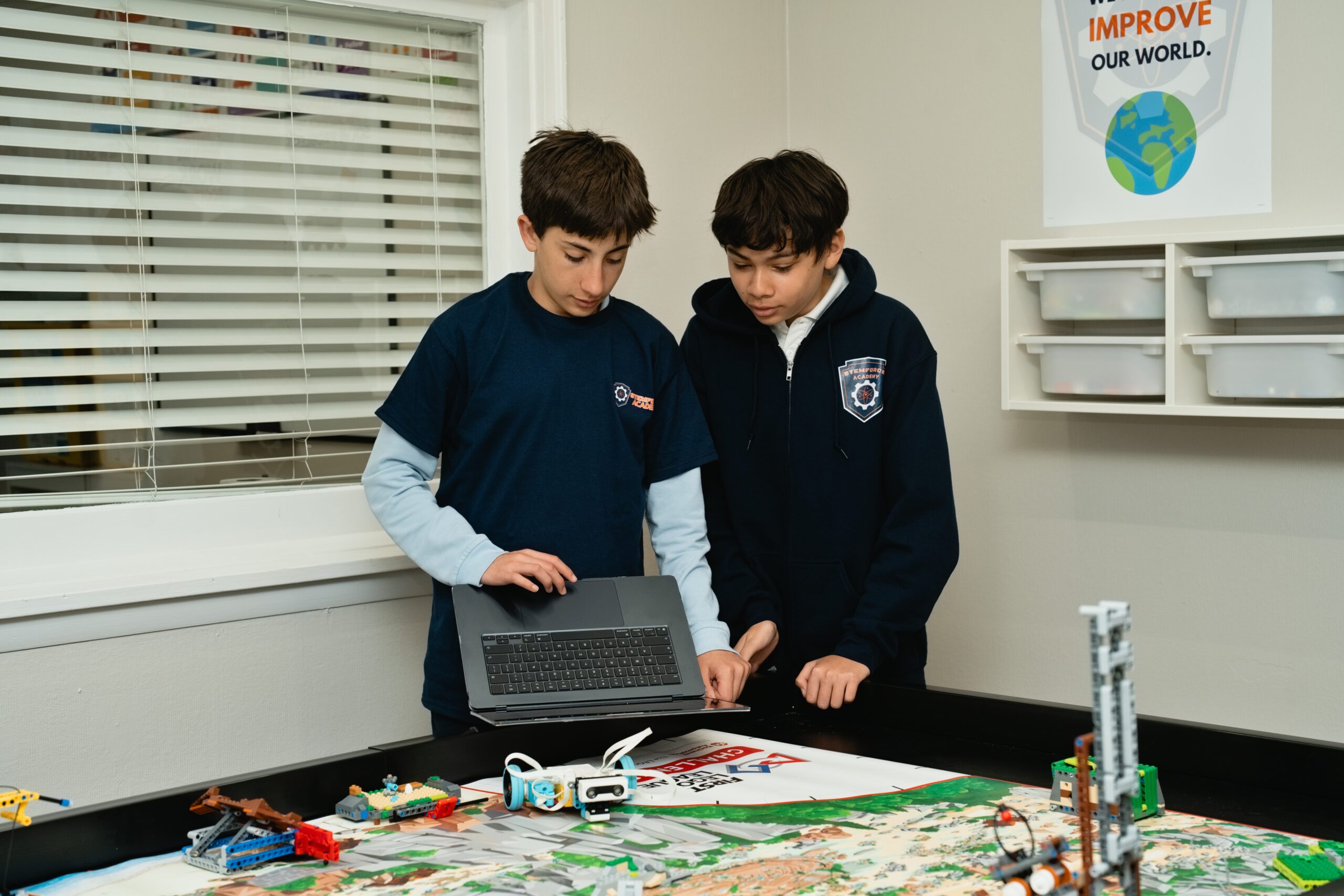 Students collaborating on a game design project at STEMForce